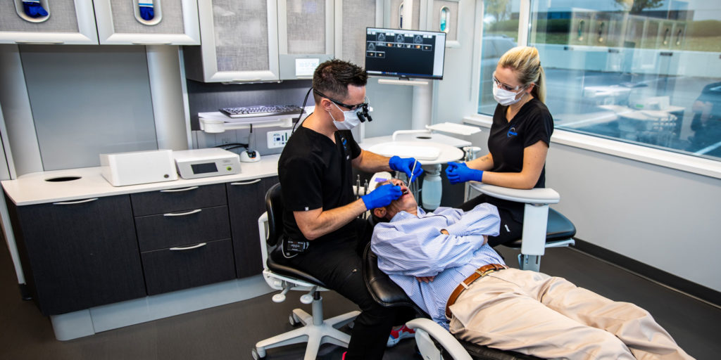 dr chambers performing dental procedure