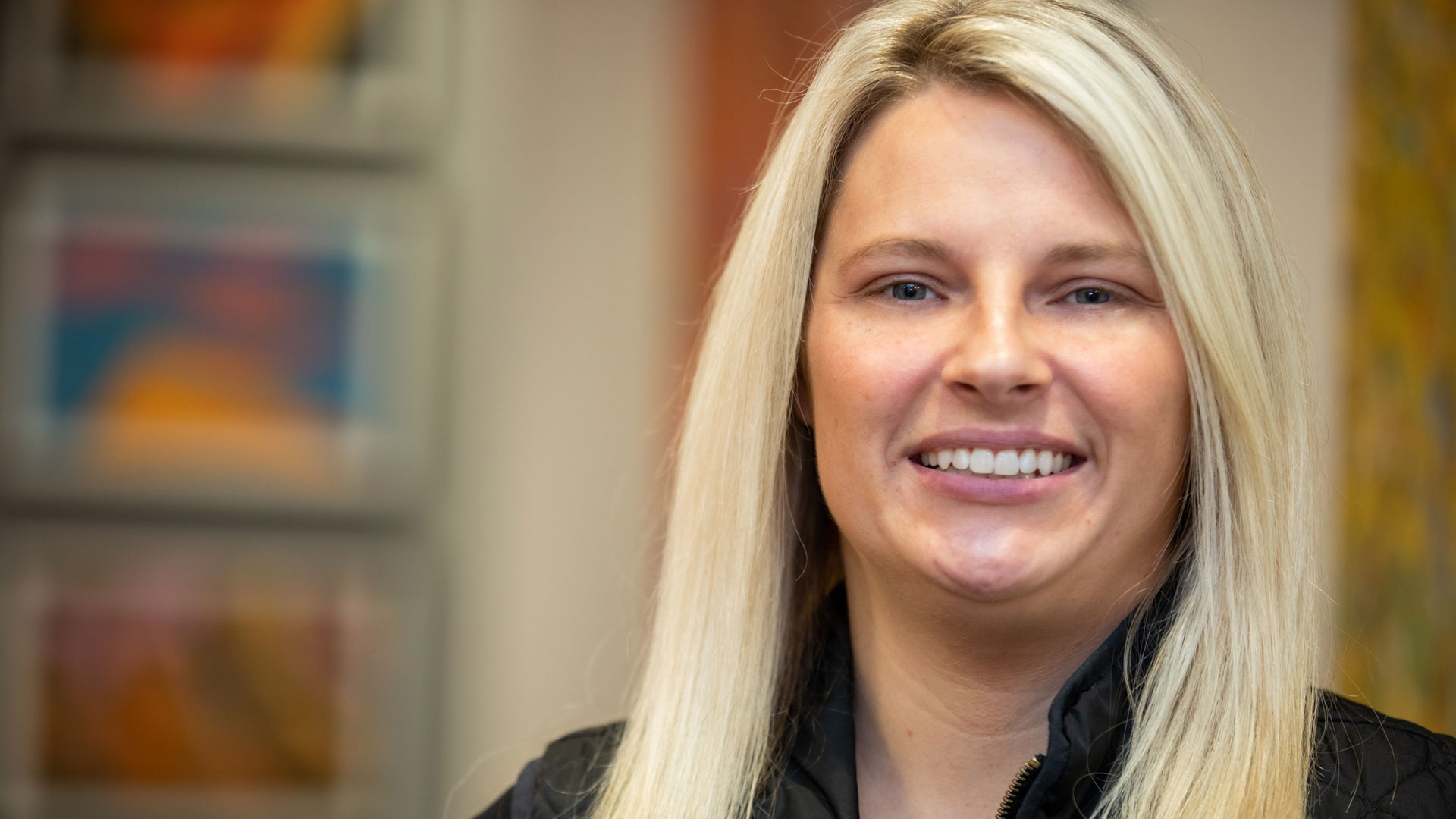 a photo of amber a patient at bluegrass dental smiling with confidence from her treatment
